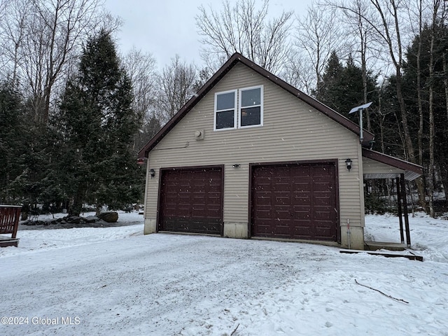 view of snow covered garage