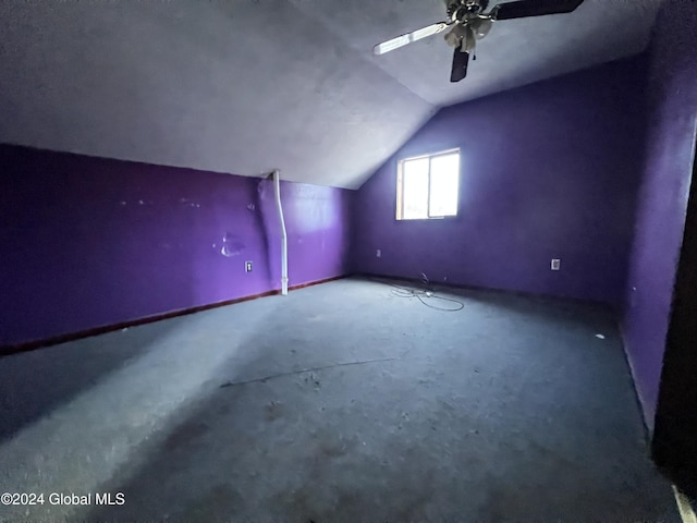 additional living space with ceiling fan and lofted ceiling