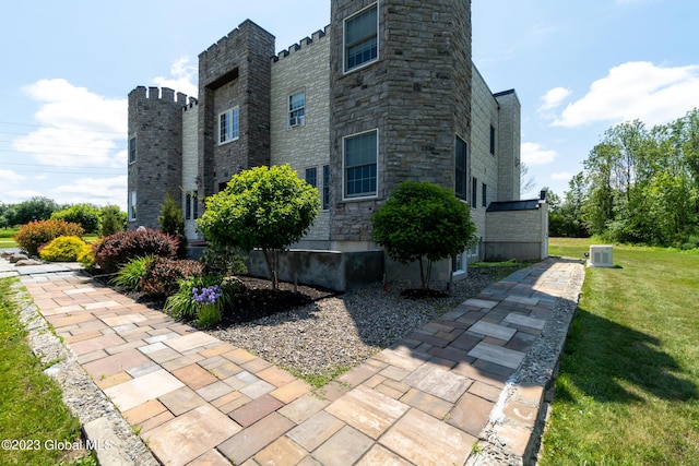 view of home's exterior with a lawn