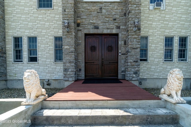 doorway to property with cooling unit