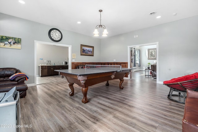 playroom with light hardwood / wood-style floors and billiards