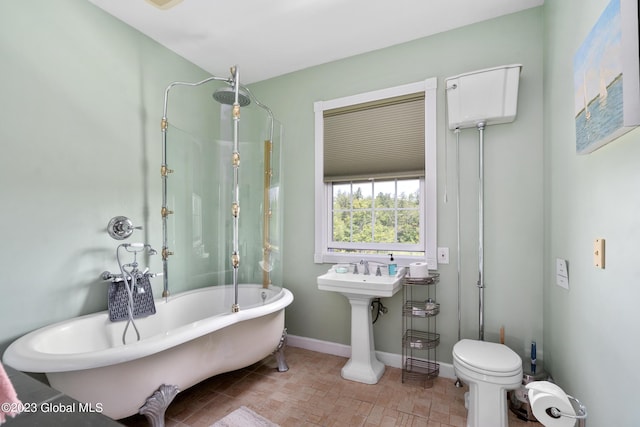 full bathroom featuring toilet, separate shower and tub, and sink