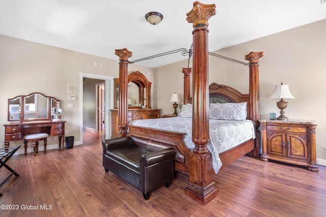 bedroom featuring dark hardwood / wood-style flooring