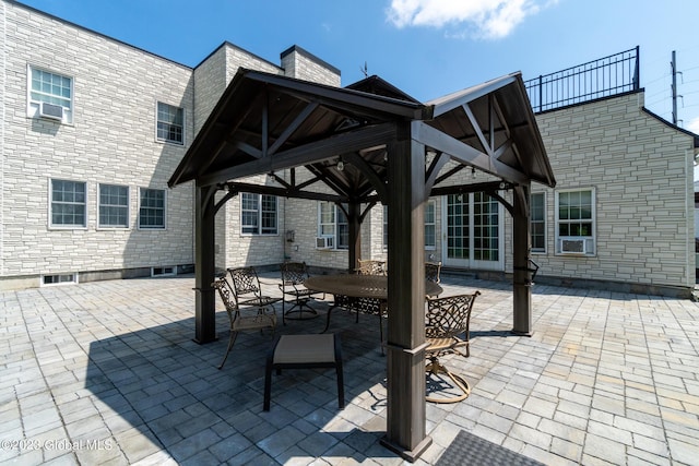 view of patio featuring a gazebo and cooling unit