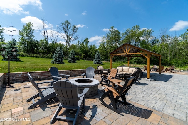 view of patio with a gazebo and an outdoor fire pit