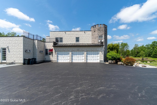 view of side of property featuring a garage