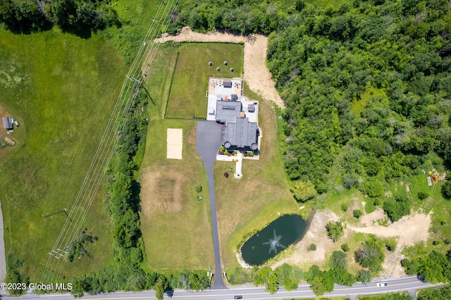 aerial view with a rural view and a water view