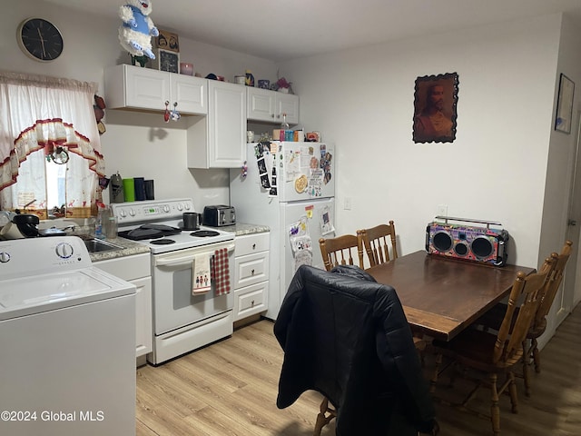 kitchen with white cabinets, white appliances, washer / clothes dryer, and light hardwood / wood-style floors