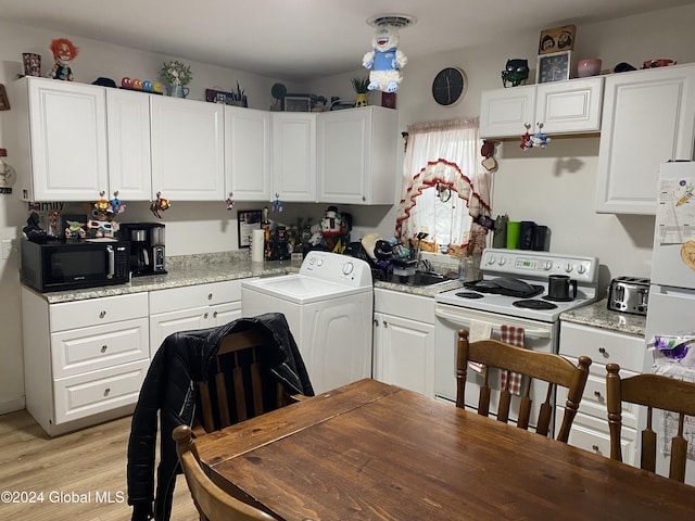 kitchen with white cabinets, electric stove, light hardwood / wood-style flooring, light stone countertops, and washer / dryer