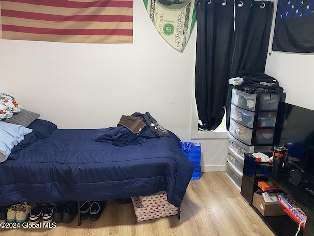 bedroom featuring wood-type flooring