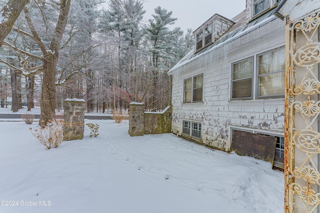 view of yard covered in snow