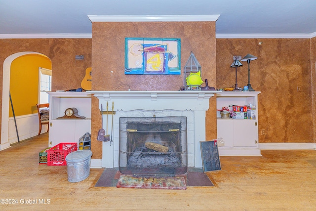 living room with hardwood / wood-style flooring and crown molding