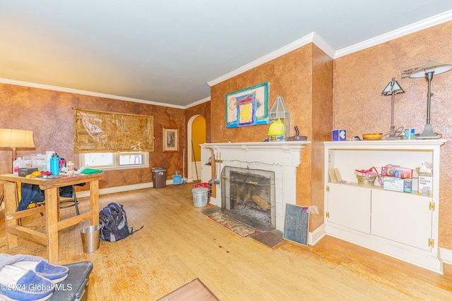 living room featuring wood-type flooring and ornamental molding