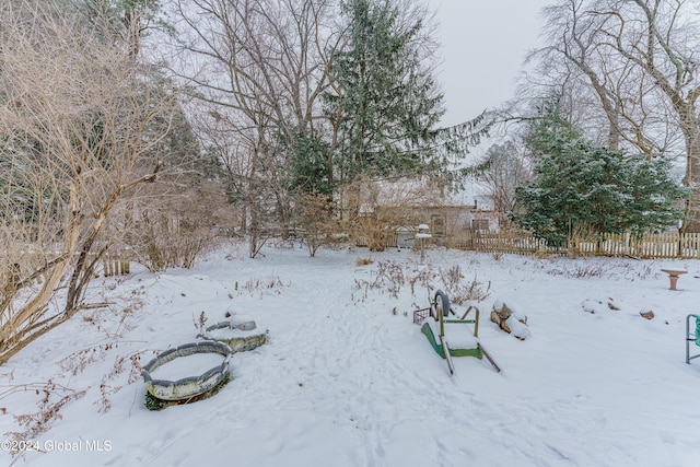 view of yard covered in snow