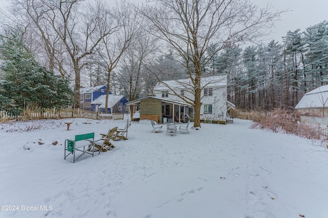 view of yard layered in snow