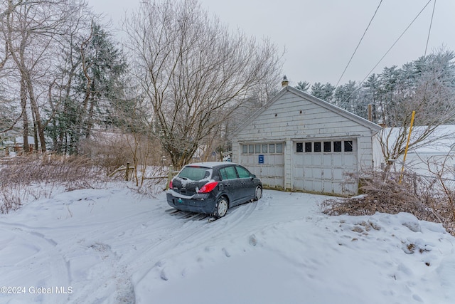 view of snow covered garage