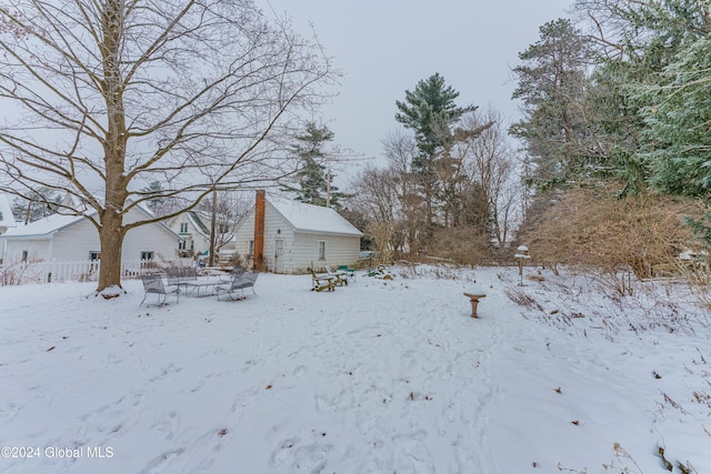 view of yard covered in snow