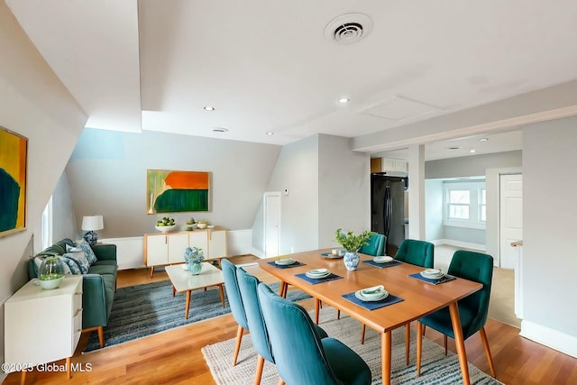 dining room featuring recessed lighting, visible vents, attic access, and wood finished floors