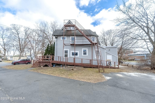rear view of house with a balcony
