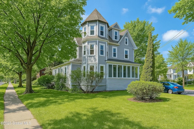 view of property exterior featuring a lawn