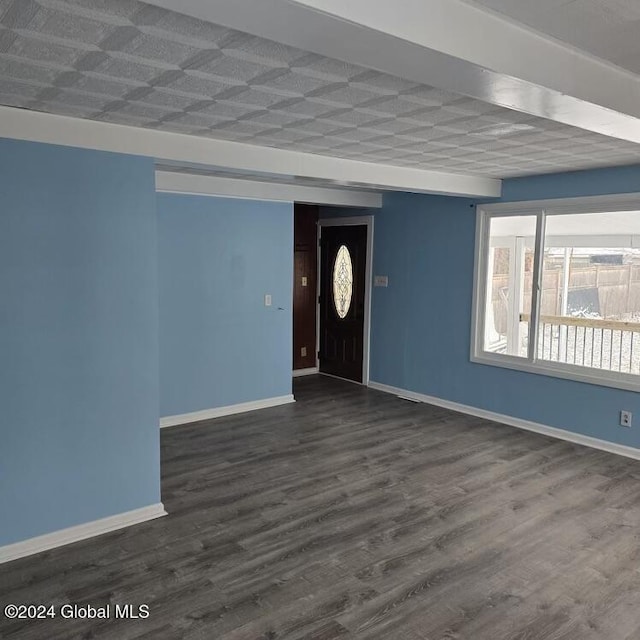 spare room featuring dark wood-type flooring