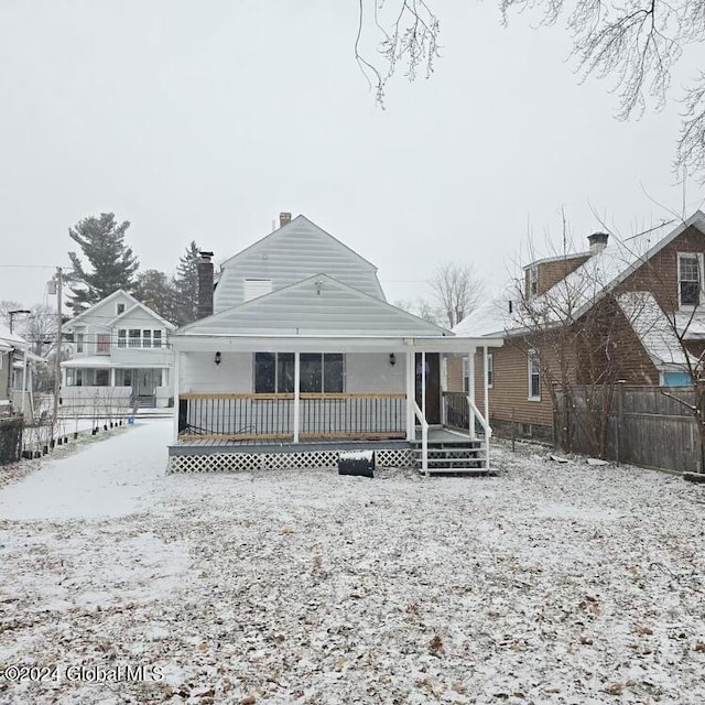 view of snow covered house