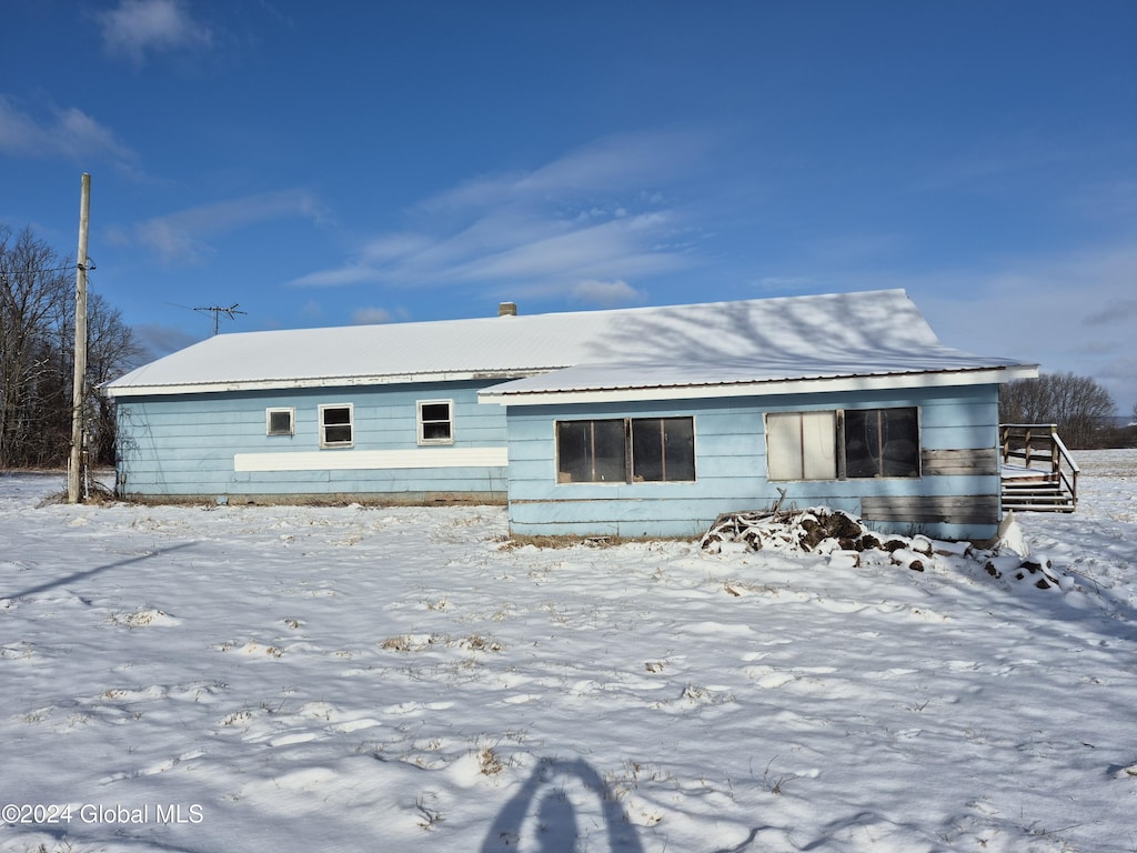 view of snow covered property