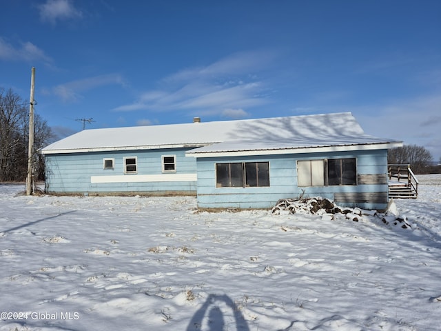 view of snow covered property