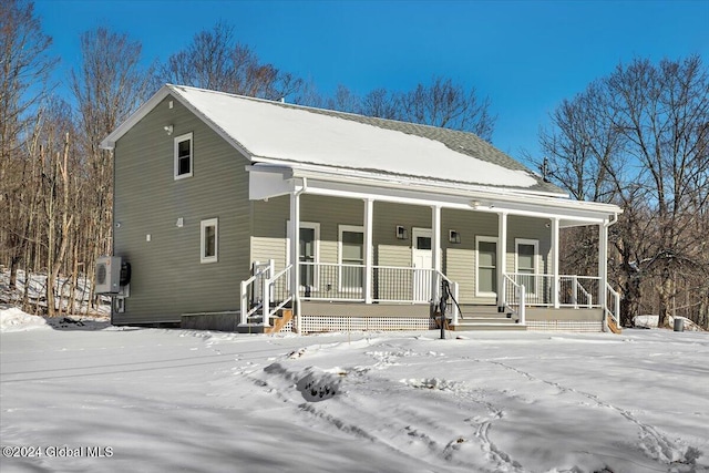 view of front of property featuring ac unit