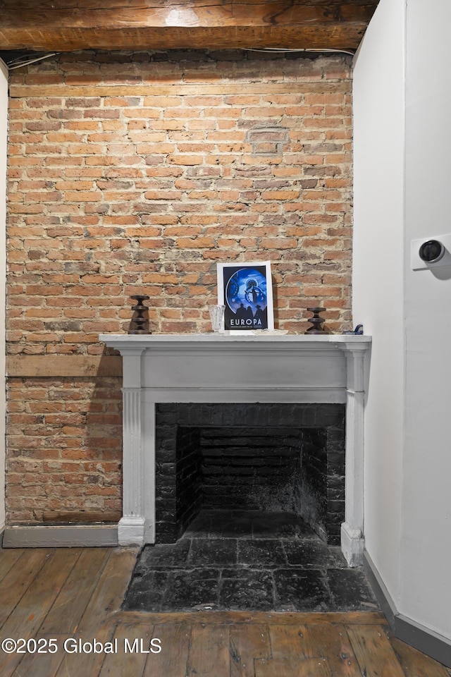 room details with wood-type flooring and a fireplace