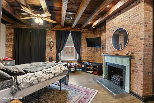 bedroom featuring hardwood / wood-style flooring, ceiling fan, beam ceiling, and wood ceiling