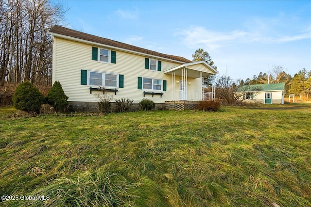 back of house with a yard