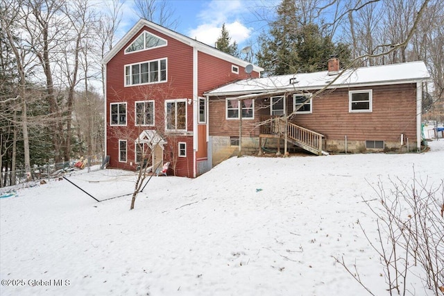 view of snow covered house