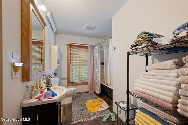 full bathroom featuring vanity, toilet, and shower / bathtub combination with curtain