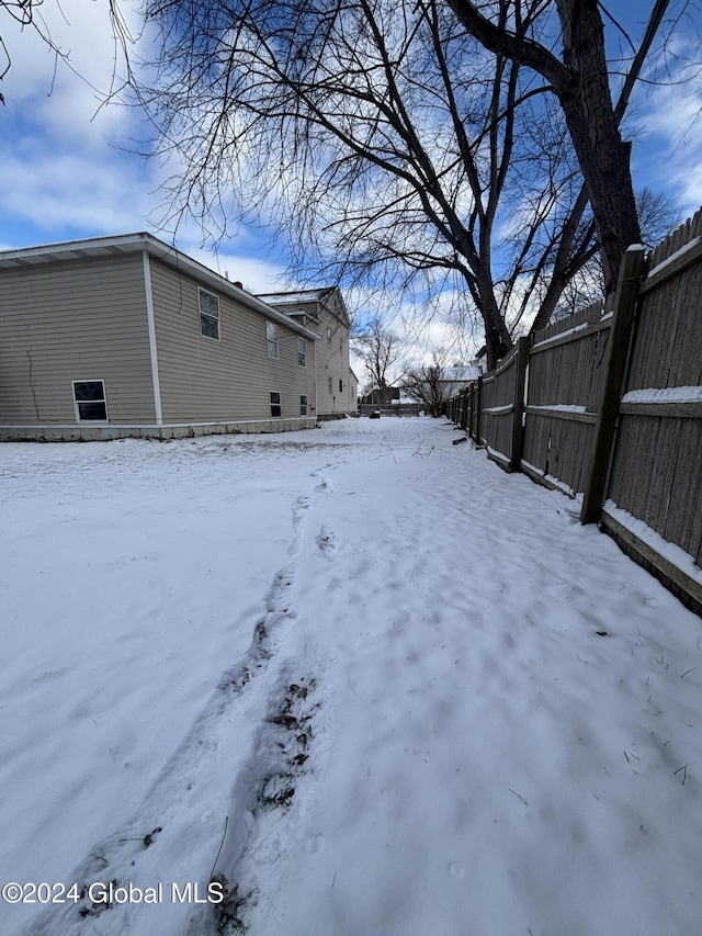 view of yard covered in snow