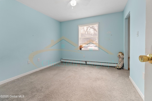 unfurnished room with carpet floors, a baseboard radiator, and ceiling fan