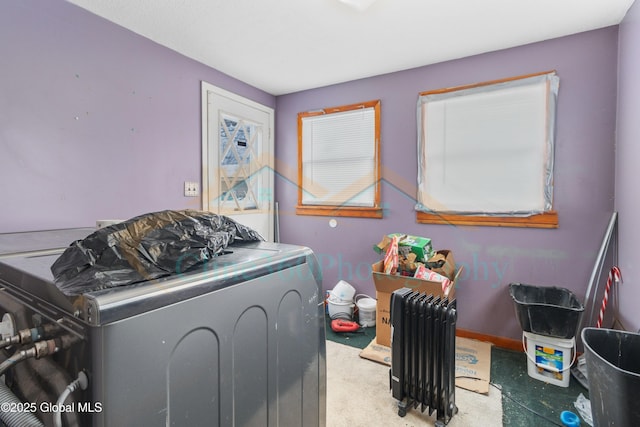 laundry room with radiator and washer / clothes dryer