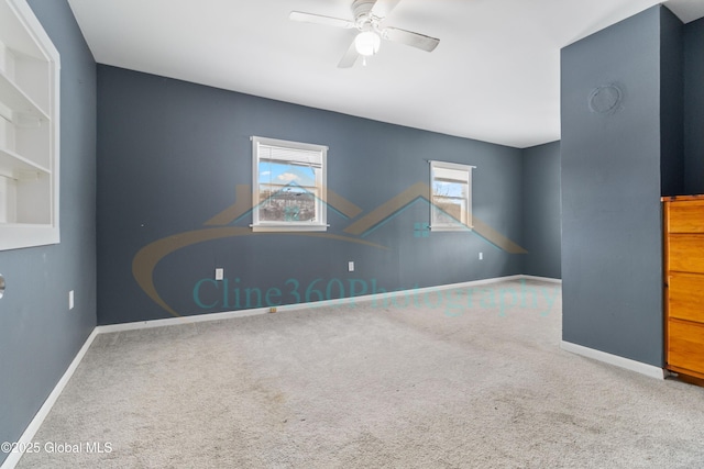 empty room with carpet flooring and ceiling fan