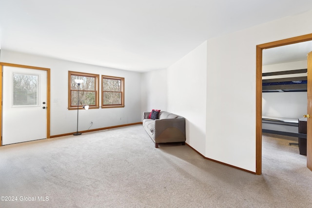 unfurnished room featuring light colored carpet