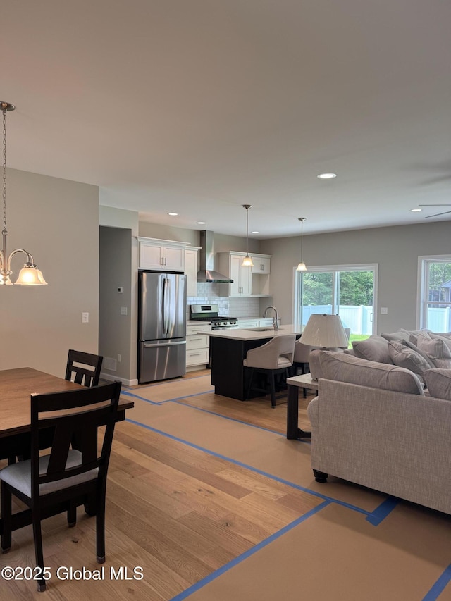 176 Butler Rd, Moreau, NY 12828 - living room with a chandelier, recessed lighting, and light wood finished floors