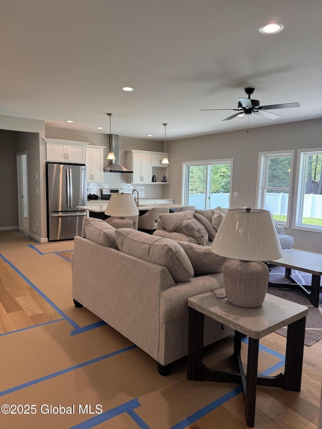 176 Butler Rd, Moreau, NY 12828 - living room with recessed lighting, a ceiling fan, light wood-style floors, and baseboards