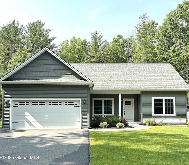 176 Butler Rd, Moreau, NY 12828 - view of front of house featuring driveway, a garage, a front yard, and roof with shingles