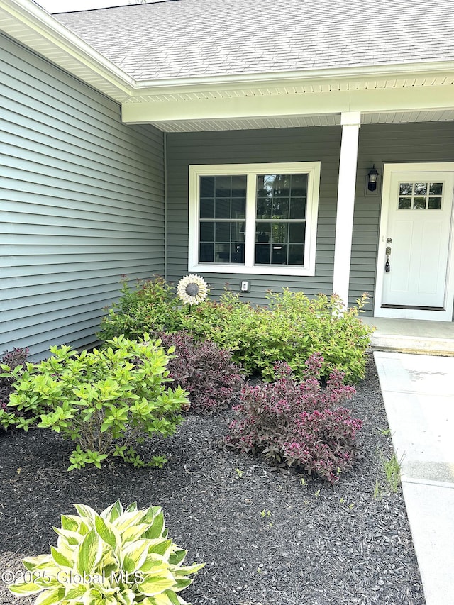 176 Butler Rd, Moreau, NY 12828 - view of exterior entry with covered porch and a shingled roof