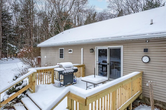 snow covered deck with area for grilling