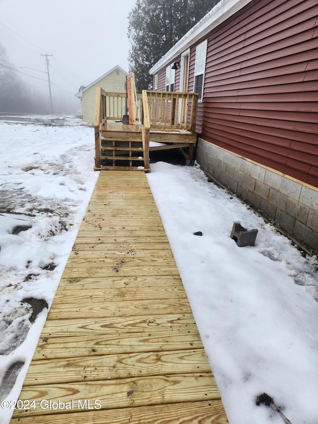 view of snow covered deck