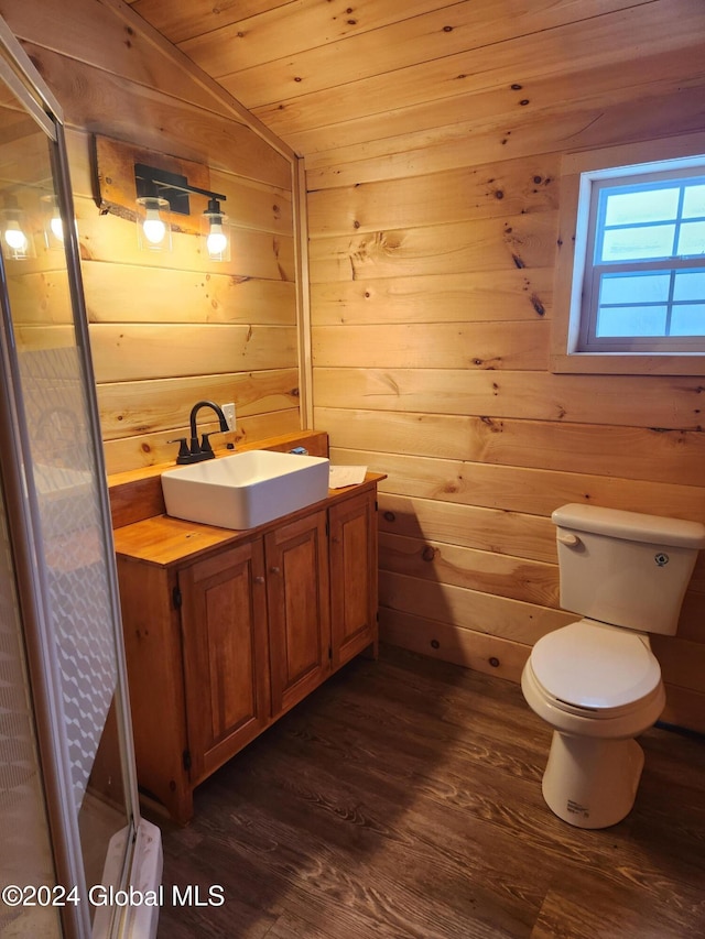 bathroom with wood walls, wood-type flooring, wooden ceiling, and vaulted ceiling