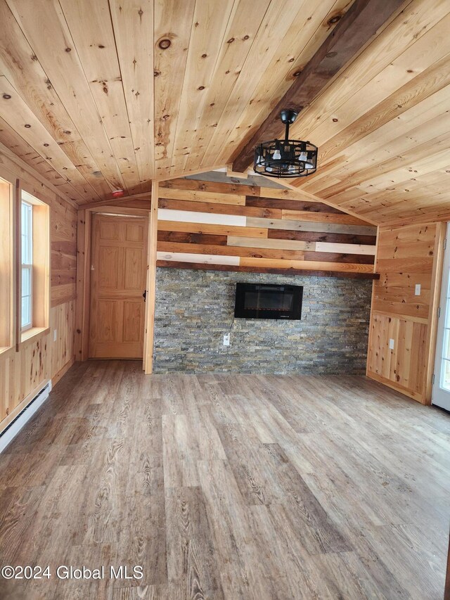 unfurnished living room with hardwood / wood-style flooring, lofted ceiling, and wood ceiling