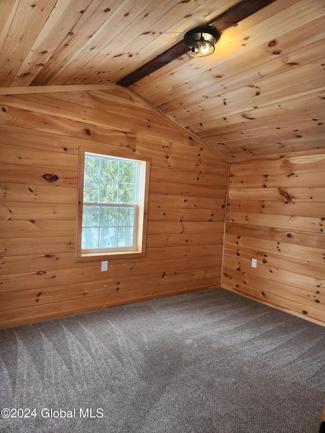 additional living space featuring carpet floors, wooden walls, and wooden ceiling