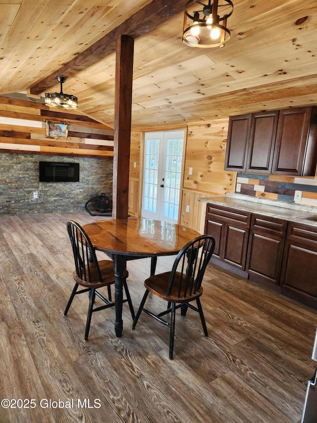 dining room with french doors, dark hardwood / wood-style flooring, and wood ceiling