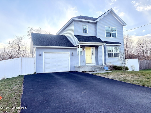 front of property with a garage